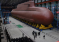 North Korea’s Kim Jong Un views submarine construction, oversees missile launch, KCNA says