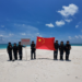 China Coast Guard officers raise national flag at Tiexian Jiao in South China Sea, clean up garbage left by illegal Philippine personnel
