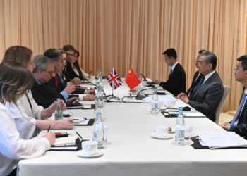 Chinese FM urges Britain to avoid imposing security implications on economic, trade issues