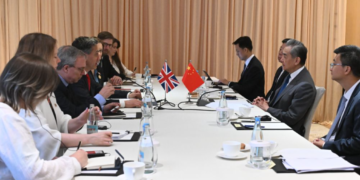Chinese FM urges Britain to avoid imposing security implications on economic, trade issues